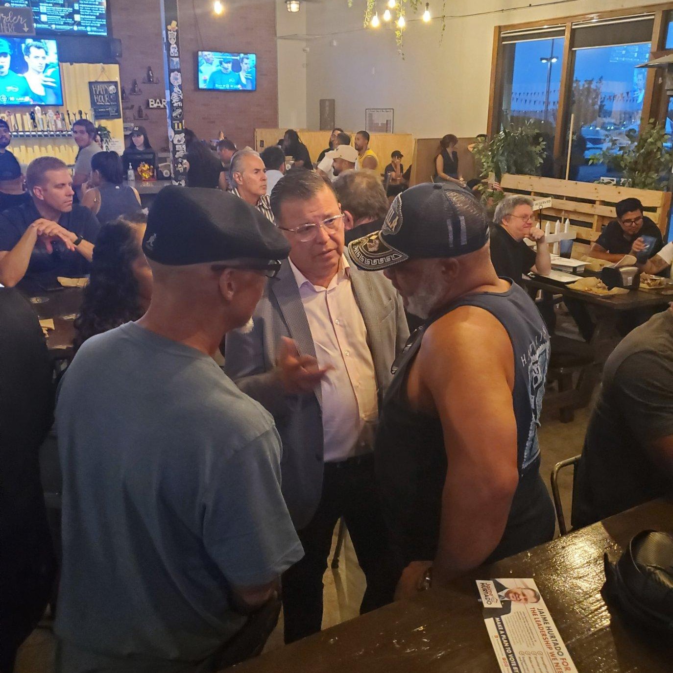 Jaime Hurtado talking with supporters at a Moreno Valley community meetup